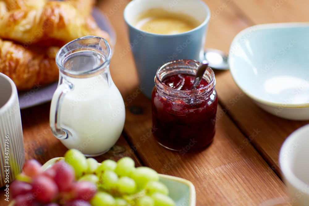 jar with jam on wooden table at breakfast jar with jam on wooden table at breakfast