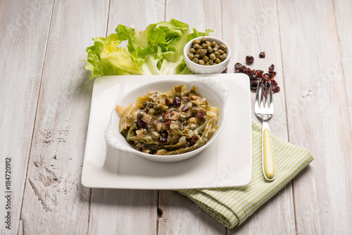 sauteed endive salad with caper dried grape and date fruit