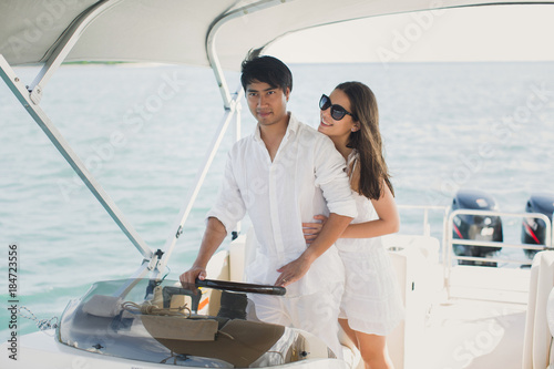 Young couple navigating on a yacht in Indian ocean © Artem Zakharov