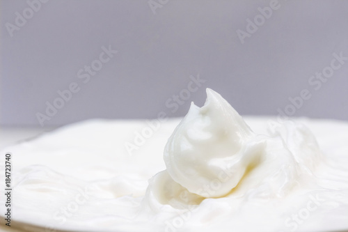 Moisturizing cream in an open jar. Close-up view.