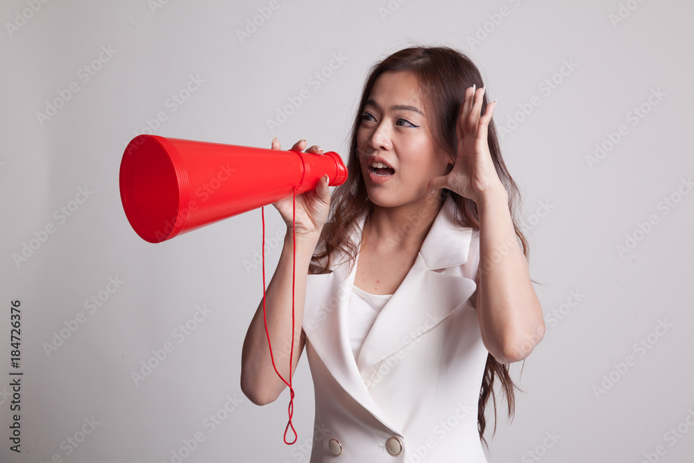 Beautiful young Asian woman announce with megaphone. Beautiful young Asian woman announce with megaphone.