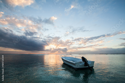 Beautiful sunset with fishing boat © Artem Zakharov