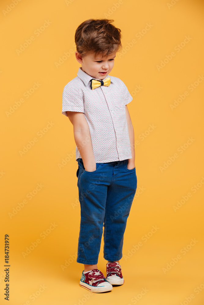 Happy little boy child standing isolated Happy little boy child standing isolated