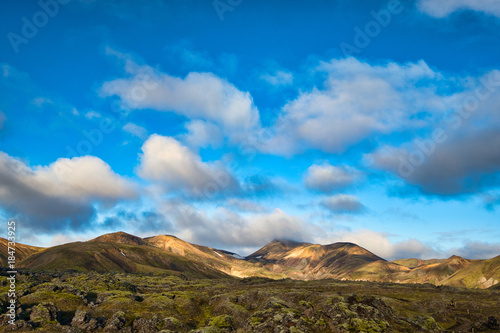 Colorful sunset over Landmannalaugar National Park. Icelandic popular geothermal area. Scenic shot of beautiful dramatic landscape.