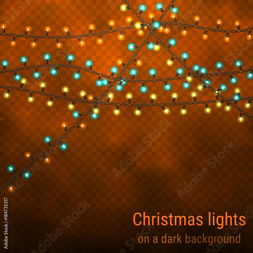 Festive background with luminous garlands. Christmas house lights on a night background