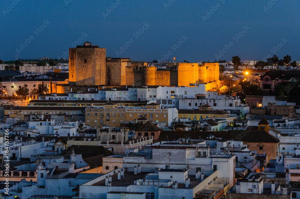 Illuminated castle in San Lucar de Barrameda, Spain