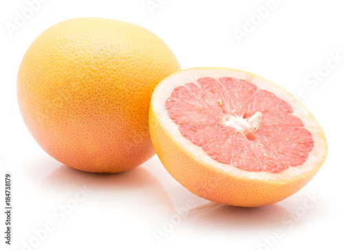 Red grapefruit isolated on white background one whole and one cross section half.