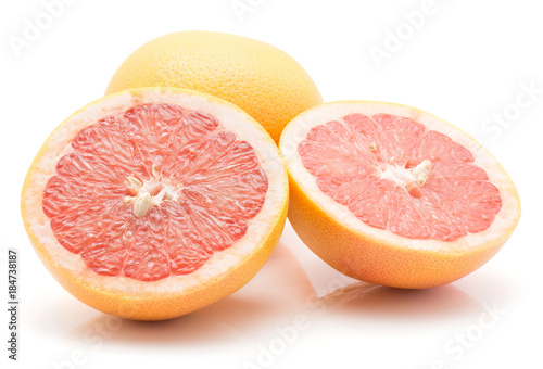 Red grapefruit isolated on white background one whole and two cross section halves.