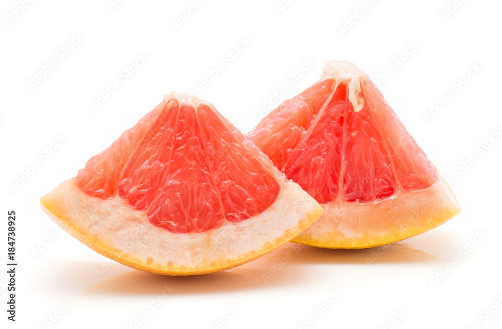 Two red grapefruit pieces isolated on white background. Two red grapefruit pieces isolated on white background.