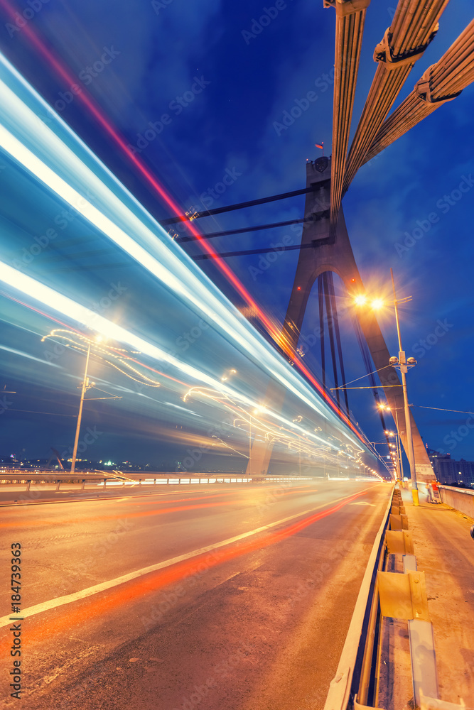 The light trails on the Moscow bridge in Kiev at night