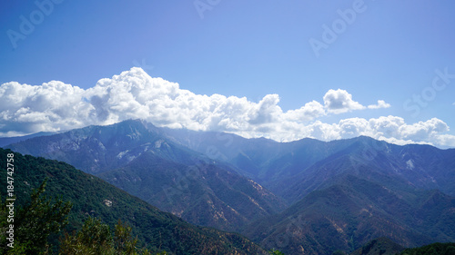 Mountain Top Vista with Blue Sky and Clouds
