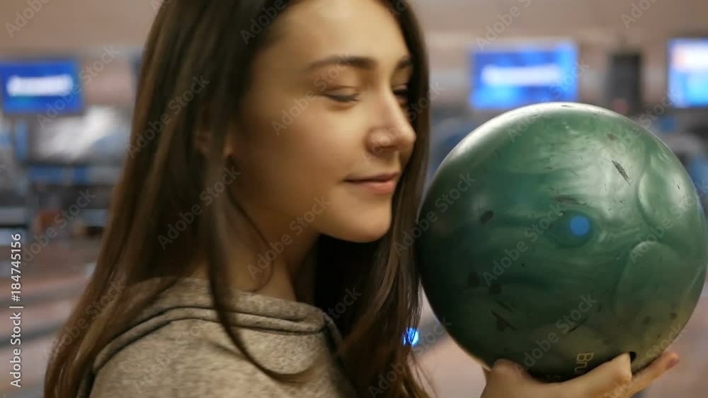 Woman in club for bowling is throwing ball Woman in club for bowling is throwing ball