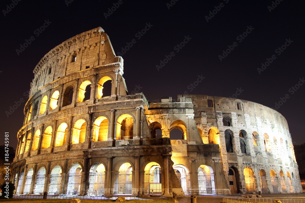 Colosseum in Rome lit up at night 