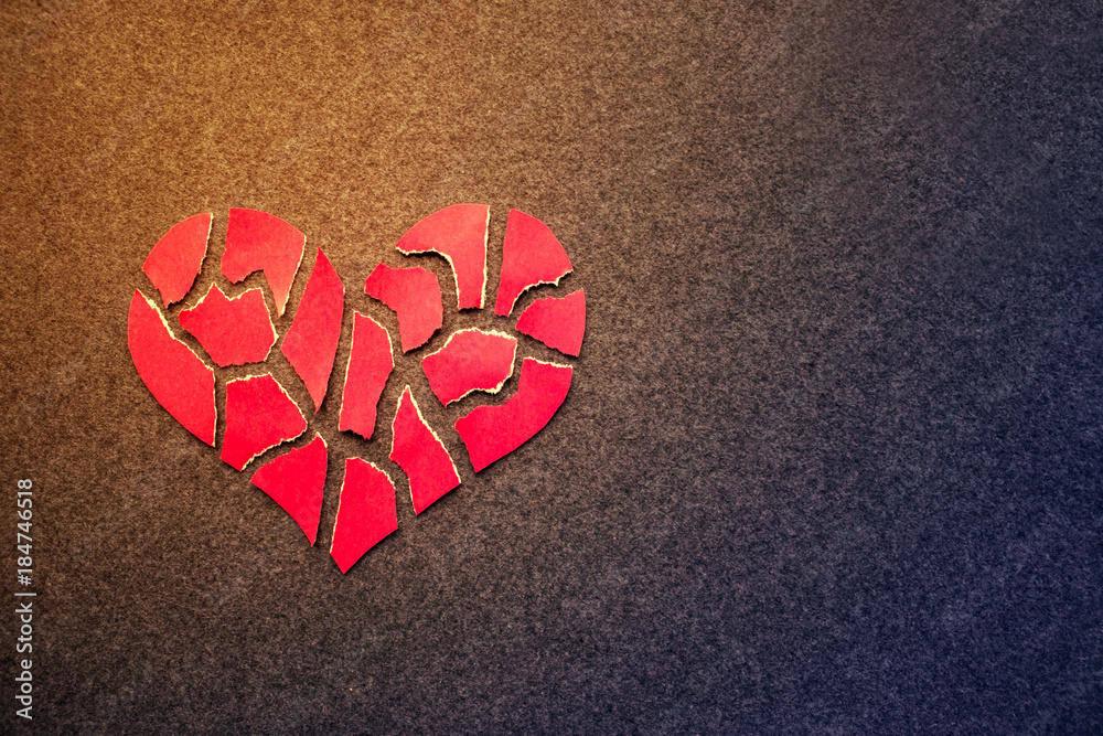 Paper red broken heart on dark felt background. Mosaic paper heart from  pieces. Cracked heart symbol. Broken love concept. Copy space Stock Photo |  Adobe Stock