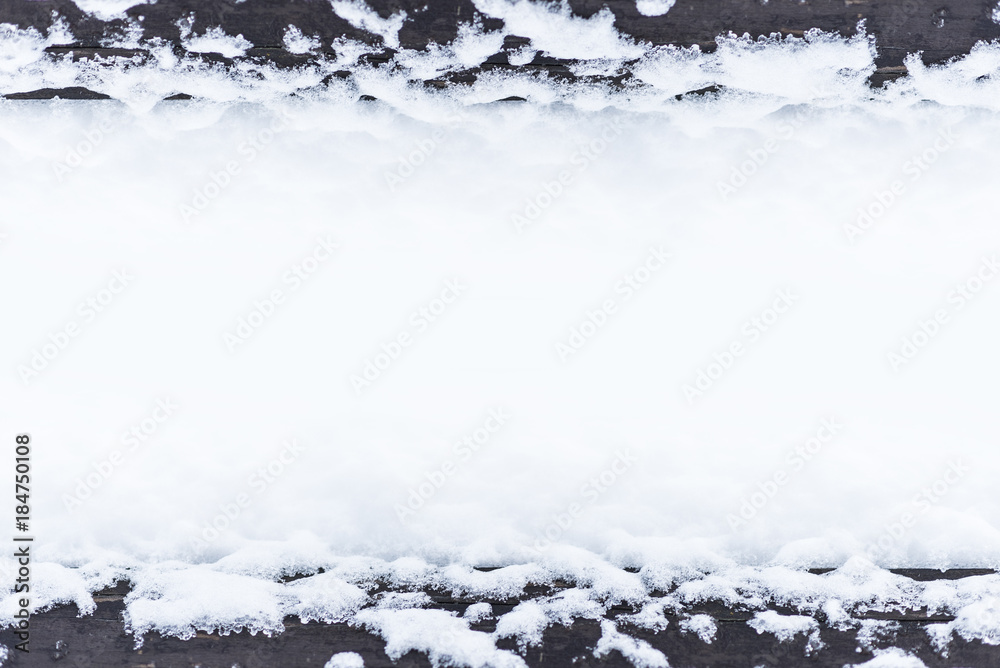 Fotografie Snow on a wooden surface, design pattern with space, space for text, winter post
