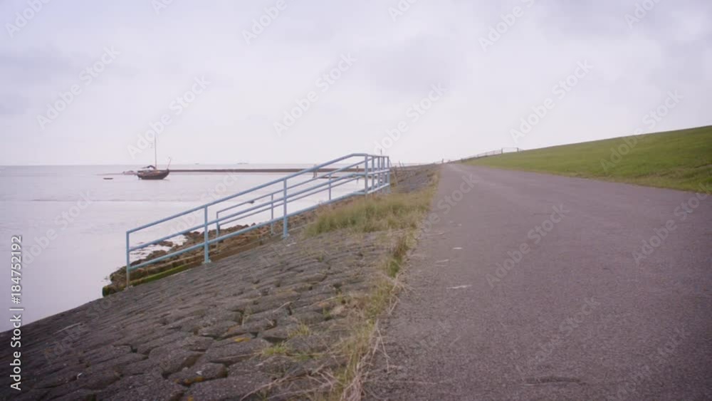 Dutch sea dike sluice gate polder drainage water outlet inspection road Dutch sea dike sluice gate polder drainage water outlet inspection road