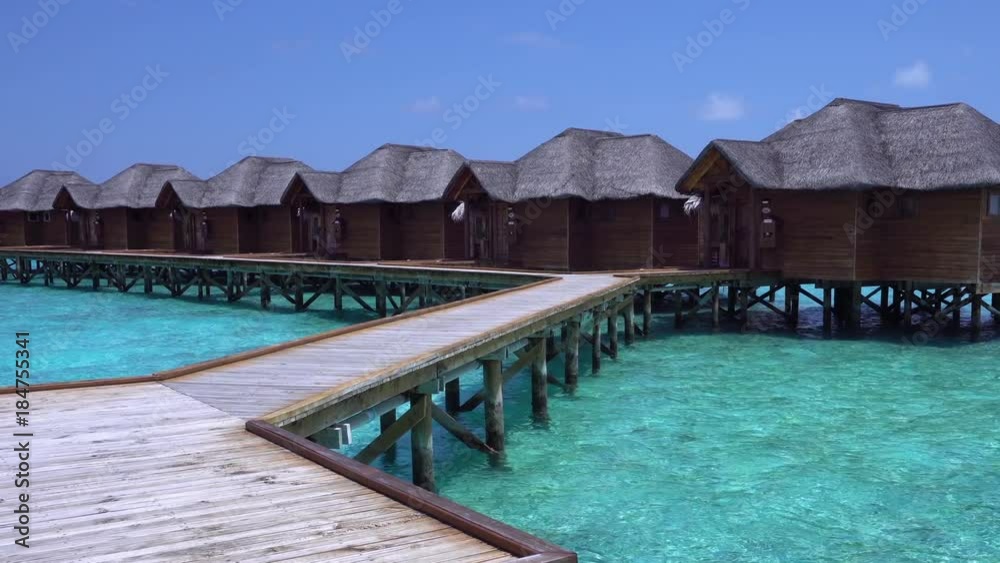 Tropical travel card with pristine beach and water bungalows at maldivian island Tropical travel card with pristine beach and water bungalows at maldivian island