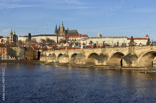 View on the winter Prague gothic Castle with the Charles Bridge in the sunny Day, Czech Republic © Kajano