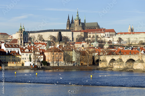 View on the winter Prague gothic Castle with the Charles Bridge in the sunny Day, Czech Republic