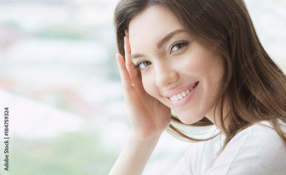 Beauty smiling model with natural make up and long eyelashes Beauty smiling model with natural make up and long eyelashes