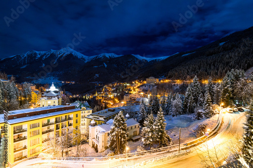 Little village in the night during winter with a lot of snow in the alps