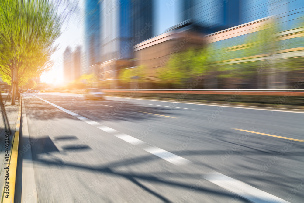 blurred asphalt road through modern city in China