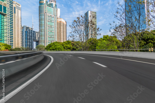 Empty asphalt road through modern city in Shanghai  China.