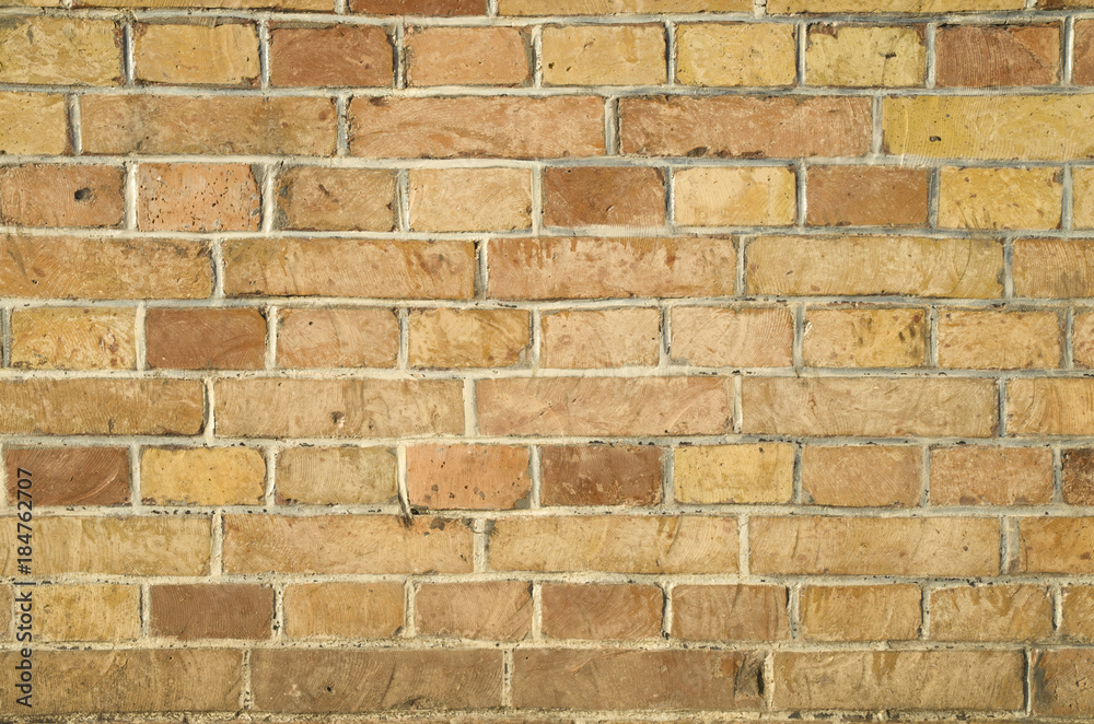 Fototapeta premium Old colorful brick wall closeup