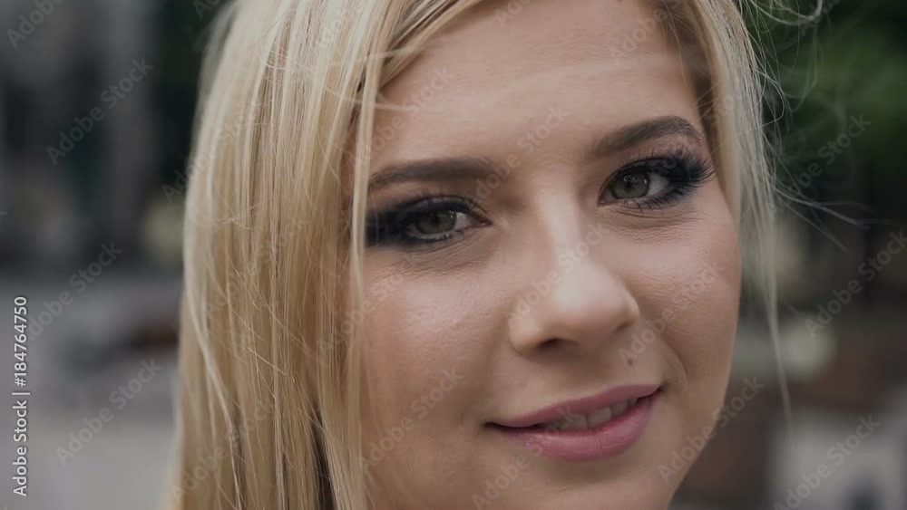 Get on the camera. Close up of the face of a young girl. Blonde. Pretty Woman