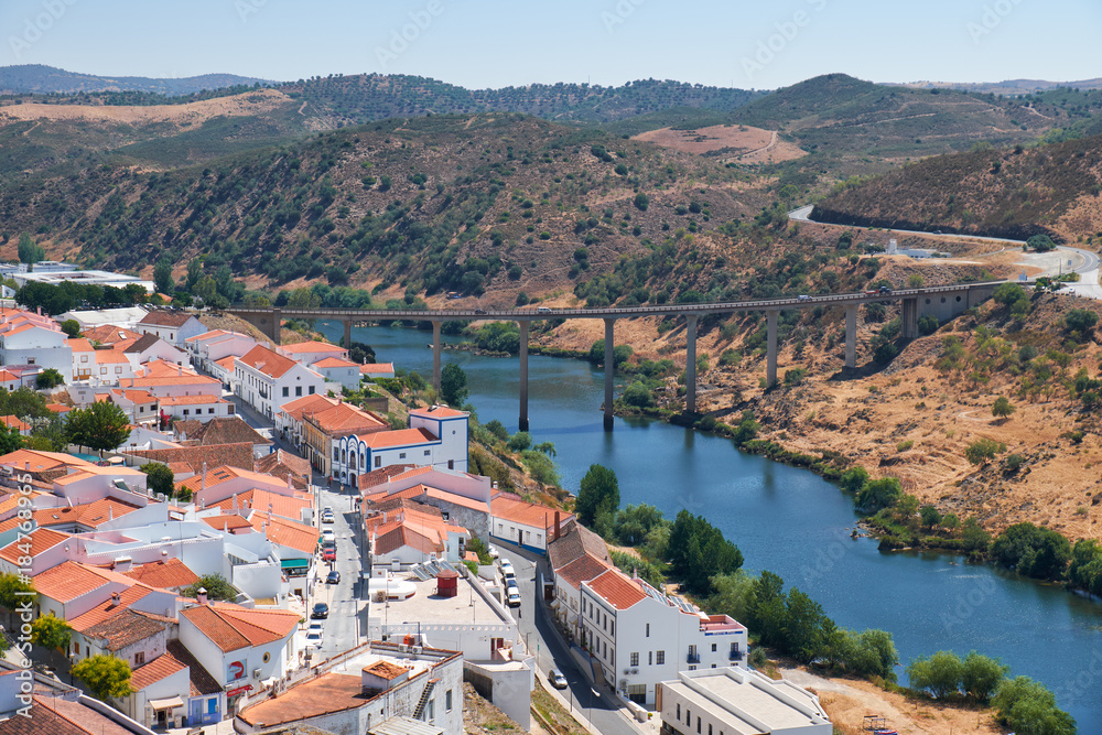 Mertola city on the riverside of Guadiana and the bridge on the background. Portugal