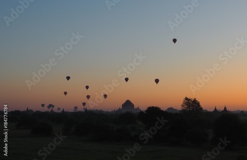 Balloons flying over Dhammayangyi Temple in Bagan Myanmar  Ballooning over Bagan is one of the most memorable action for tourists.