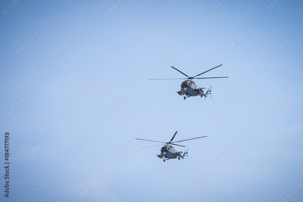 military helicopters flying in the blue sky military helicopters flying in the blue sky