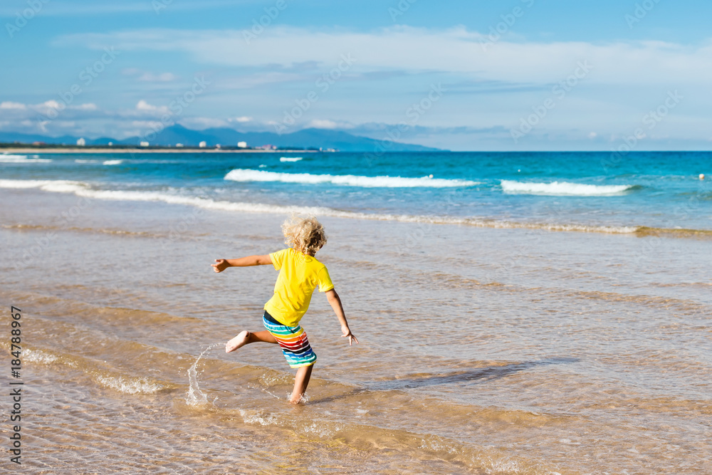 Child on tropical beach. Sea vacation with kids. Child on tropical beach. Sea vacation with kids.