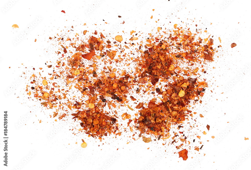 pile crushed red cayenne pepper, dried chili flakes and seeds isolated on white background, top view