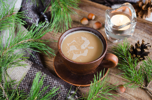 Hot cocoa, warm pleid and candle. Rustic life. photo