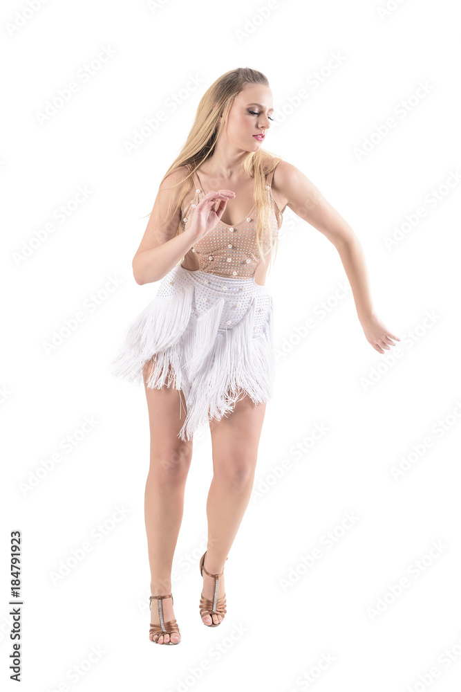 Confident professional woman dancer dancing latino style in cream color costume with fringes. Full body length portrait isolated on white background. 