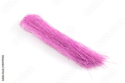 Purple color of rice vermicelli isolated on white background, Colorful vegetarian noodles food background.