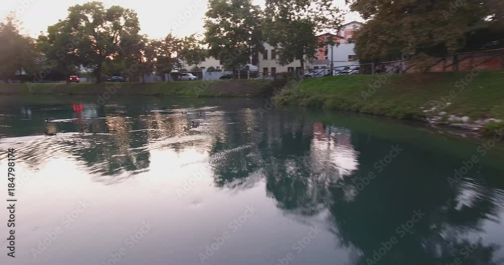 video 4k flight over the water of the city river, travel around Italy. flight over mountain river video 4k flight over the water of the city river, travel around Italy. flight over mountain river