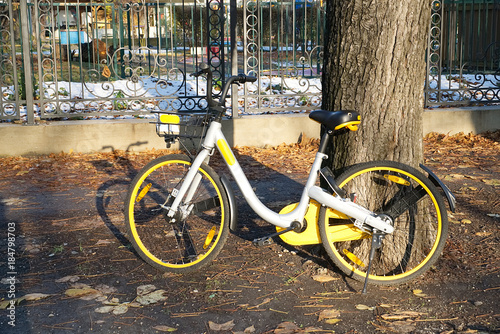 A yellow bike in Prater Park in Vienna, Austria in December                              