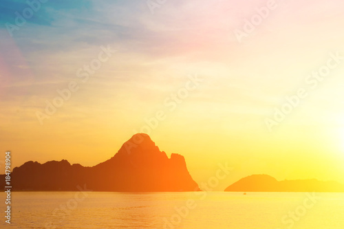 Bright colors at dawn on the beach at sunrise in the Gulf of Thailand.