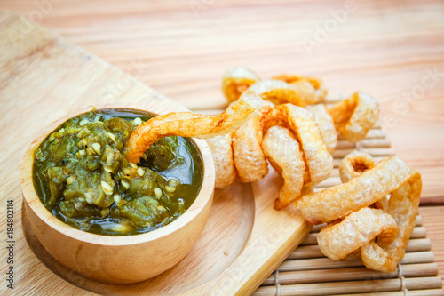 Nam prik num (Northern Thai Green Chilli Dip) and Pork snack. photo