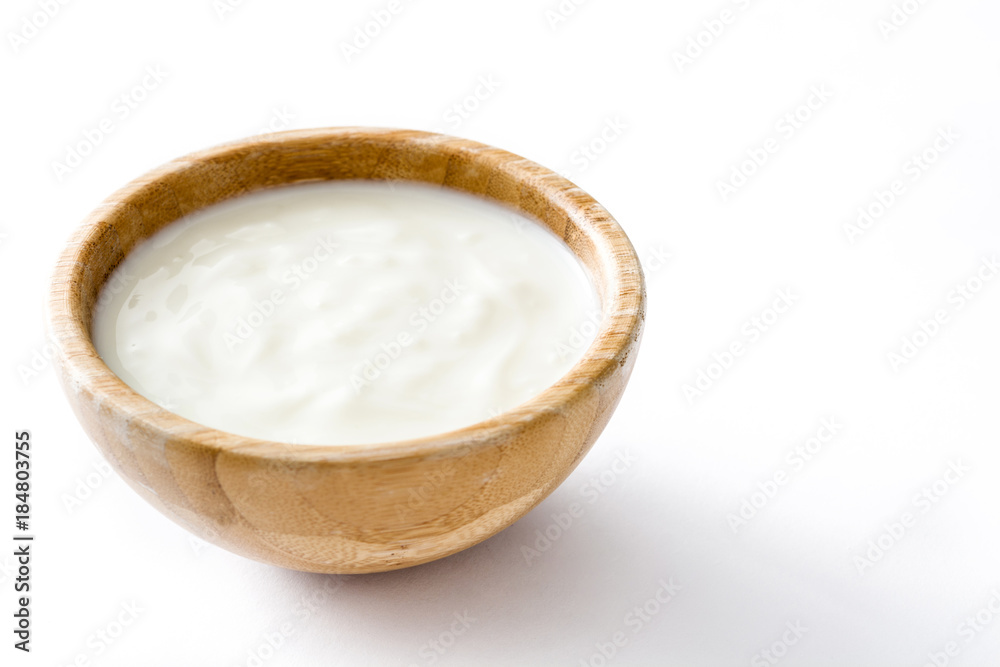 Natural yogurt in wooden bowl isolated on white background Natural yogurt in wooden bowl isolated on white background