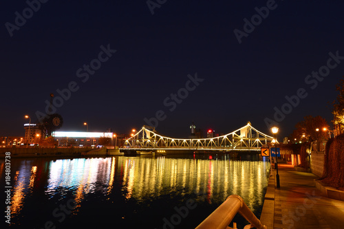 The modern city highway Bridges night landscape car light trails arc in tianjin
