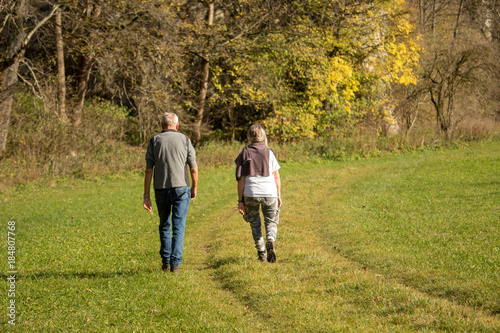 couple walk in park © kirollos