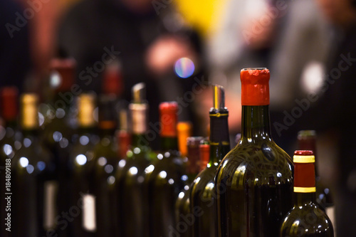 Row of vintage wine bottles in luxury wine cellar