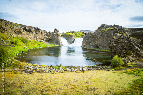 View of Hjalparfoss waterfall of Iceland