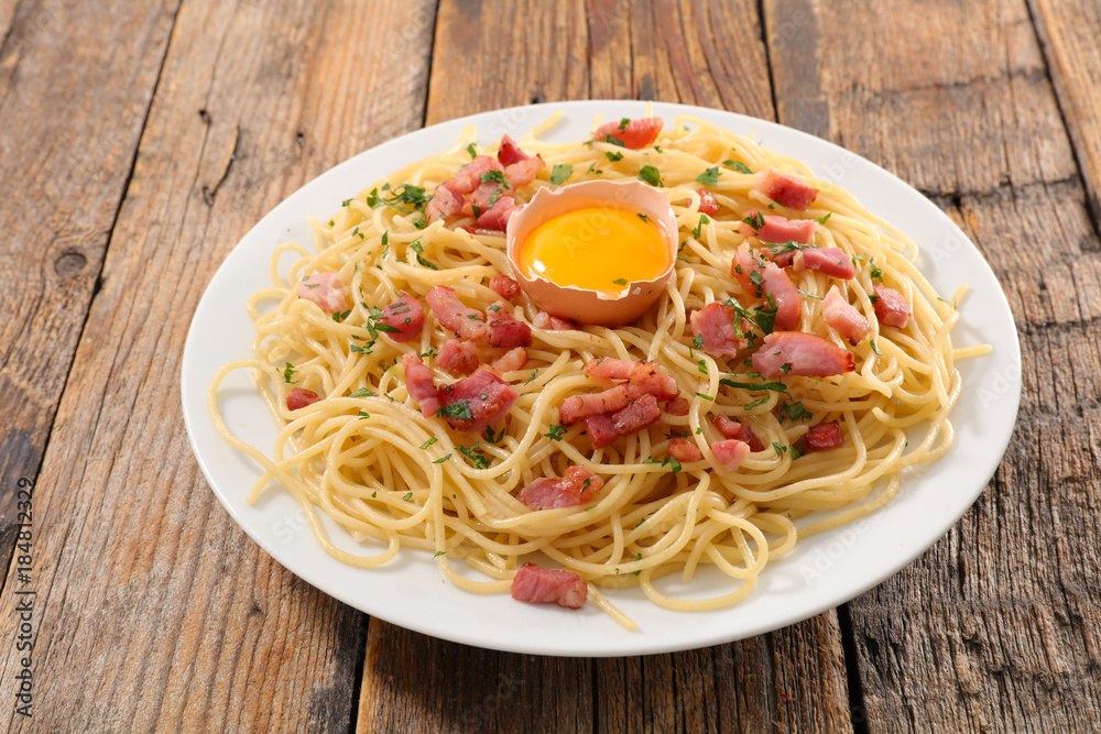 carbonara spaghetti on wood background