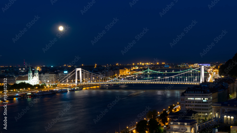 Moon over the bridge in Budapest
