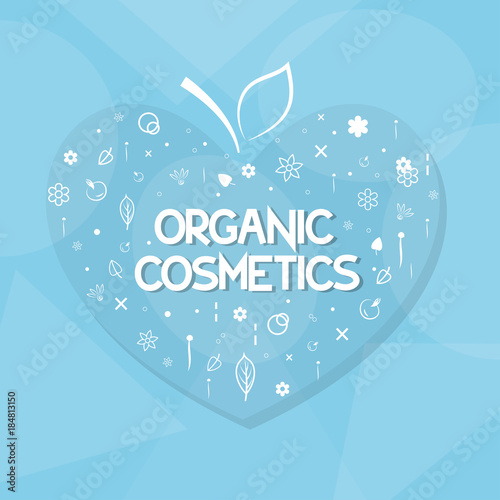 organic cosmetics and herbs in the shape of heart on a blue background