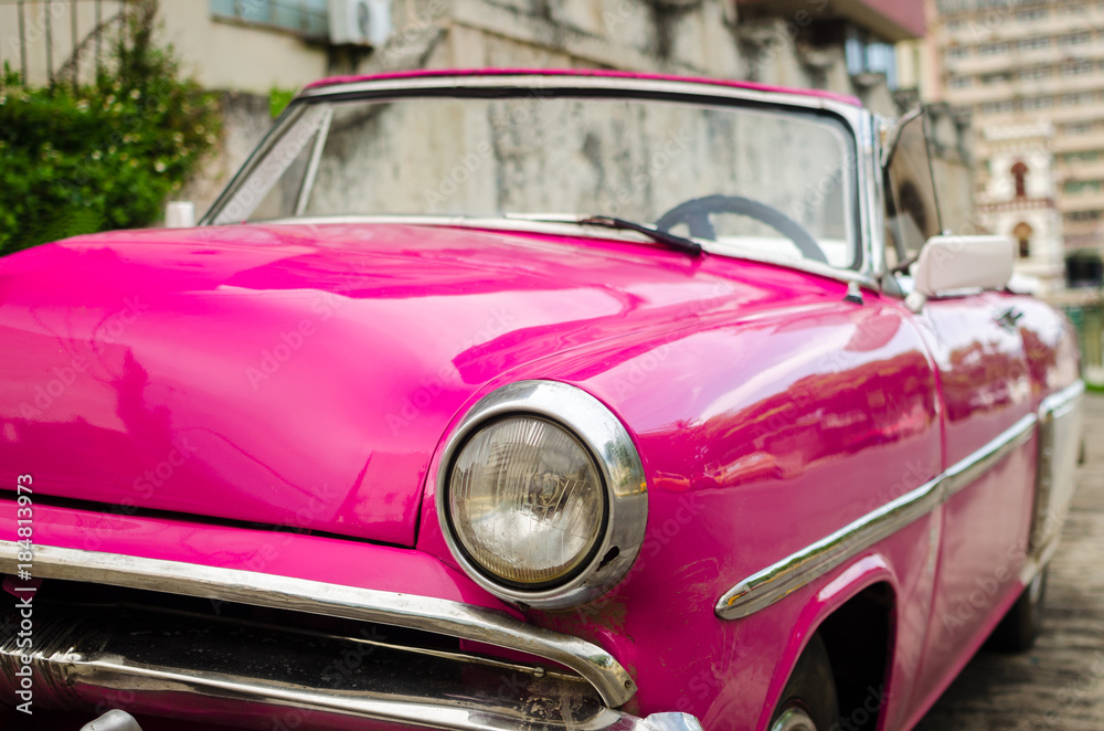 Pink American oldtimer in the street of Havana, Cuba